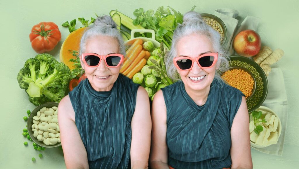 Otto Settimane di Dieta Vegana Ringiovaniscono il DNA! 1 Coppia di gemelle anziane con occhiali da sole rosa e sfondo di verdure fresche